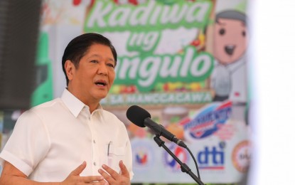 <p><strong>AID TO FISHERS</strong>. President Ferdinand R. Marcos Jr. delivers his speech during the launch of a special Kadiwa ng Pangulo (KNP) outlet called "KNP Para sa Manggagawa" at the Trade Union Congress of the Philippines compound in Quezon City on Wednesday (March 8, 2023). In an interview, Marcos said the agriculture department, which he heads, has opened a cash-for-work setup for fishers to help them cope with the impact of a fishing ban due to an oil spill in Oriental Mindoro. <em>(PNA photo by Rey S. Baniquet)</em></p>