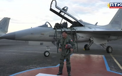 <p><strong>MODERNIZATION.</strong> President Ferdinand R. Marcos Jr. poses for a photo after flying onboard one of the Philippine Air Force's (PAF) FA-50 fighter jets at Clark Air Base in Pampanga on Tuesday (March 7, 2023). Marcos lauded the flight maneuver skills of PAF pilots, emphasizing the need to continue modernizing the country’s armed forces.<em> (Screengrab from RTVM)</em></p>