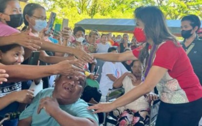 <p><strong>VISIT</strong>. Senator Imee Marcos (right) is greeted by women in Silay City, Negros Occidental during her visit on Thursday (March 9, 2023). She distributed PHP3,000 cash assistance each to 1,000 disadvantaged women in the city and wheelchairs to female persons with disabilities. <em>(Photo courtesy of Senator Imee R. Marcos Facebook page)</em></p>