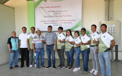 <p><strong>POSTHARVEST FACILITIES.</strong> Department of Agriculture-Central Luzon Regional Executive Director Crispulo G. Bautista, Jr. (5th from left) leads the turnover of an onion cold storage facility to members of the Caridad Sur Farmers Multi-Purpose Cooperative (CASFA) in Barangay Caridad Sur, Llanera, Nueva Ecija on Thursday (March 9, 2023). The DA likewise turned over another onion cold storage facility to the Kalasag Primary Multi-Purpose Cooperative in Barangay San Agustin, San Jose City, also in Nueva Ecija. <em>(Photo courtesy of the DA Region III)</em></p>