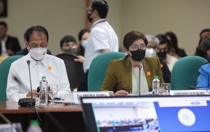 <p><strong>VAX CAMPAIGN</strong>. Ma. Rosario Vergeire (right), officer-in-charge of  the Department of Health (DOH), and former National Task Force Against Covid-19 Chief Implementer and Vaccine Czar Carlito Galvez Jr. attend Thursday (March 9, 2023) the hybrid hearing of the Senate Blue Ribbon Committee. The committee is investigating, <em>motu proprio</em>, the non-disclosure by and/or refusal of the DOH to release the details of the vaccine procurement contracts on the pretext of a supposedly existing Non-Disclosure Agreement. <em>(Photo courtesy of Senate PRIB) </em></p>