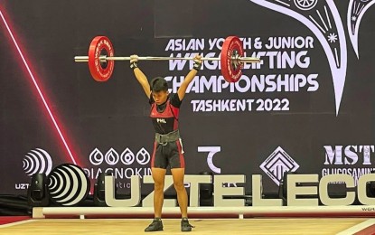 <p><strong>HOPEFUL.</strong> Angeline Colonia of Zamboanga City competes in the Youth women's 40kg. category during the 2022 Asian Youth and Junior Championships in Tashkent, Uzbekistan. She will banner the Philippine campaign at the International Weightlifting Federation Youth World Championships in Durres City, Albania scheduled from March 25 to April 1, 2023. <em>(Photo courtesy of Asian Weightlifting Federation)</em></p>