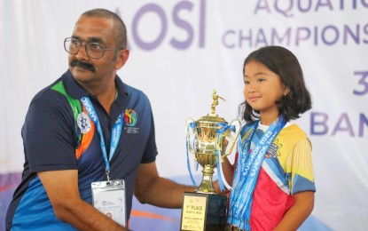 <p><strong>SWIMMING PRODIGY.</strong> Pia Severina Magat is awarded the Most Outstanding Swimmer trophy for winning seven gold medals in the girls' 7 years old and under category at the Asian Open Schools Invitational Aquatics Championships held on March 3-5, 2023 in Bangkok, Thailand. The five-year-old swimming prodigy from St. Joseph's School of Novaliches, Quezon City received the award for her victories in the 50m freestyle, 50m backstroke, 50m butterfly, 50m breaststroke, 100m freestyle, 100m backstroke and 100m breaststroke events. <em>(Contributed photo)</em></p>