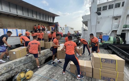 <p><strong>OIL SPILL TOOLS.</strong> Members of the Philippine Coast Guard (PCG) transported a total of 5.1 tons of equipment used in oil spill control on Sunday (March 12, 2023) sent by Japan to aid the Philippines in the oil spill cleanup in Oriental Mindoro province. The delivery included items such as oil spill response workwear, masks, oil-proof working gloves, oil-proof rubber boots, oil blotter, and oil snare. <em>(Photo courtesy of PCG)</em></p>