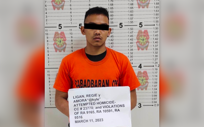 <p><strong>ALLEGED NPA HITMEN.</strong> Police and military operatives arrest Regie A. Ligan, an alleged squad leader of the New People’s Army Guerrilla Front 21, during a law enforcement operation on March 11, 2023 in Cabadbaran City, Agusan del Norte province. Ligan’s companion in the same NPA unit, identified as Gabriel R. Sagay, was also collared.<em> (Photo courtesy of PRO-13)</em></p>