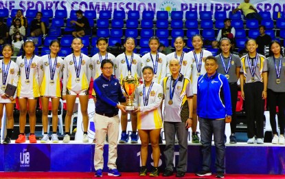 <p><strong>CHAMPION.</strong> Kizzie Madriaga of California Precision Sports of Antipolo City (front row, 2nd from left) receives the championship trophy from Philippine National Volleyball Federation president Ramon Suzara during the awarding ceremony of the PNVF Under-18 Championships at the Rizal Memorial Coliseum in Manila on Sunday (March 12, 2023). CPS defeated  Gracel Christian College Foundation of Taguig City, 25-14, 25-16, 25-18.<em> (Courtesy of PNVF)</em></p>