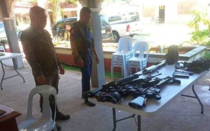 <p><strong>LAWLESS GROUP.</strong> Police officers account for the guns recovered from three slain members of a local gang in Pikit, North Cotabato, following a clash on Saturday (March 11, 2023). A police officer was also wounded in the encounter. <em>(Photo courtesy of Pikit MPS)</em></p>