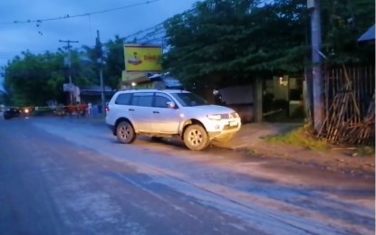 <p><strong>COUPLE AMBUSHED.</strong> Police cordon off a couple’s white Mitsubishi Montero after the pair was ambushed in Barangay Fatima, Gen. Santos City at 4:45 a.m. Tuesday (March 14, 2023). The wife died while the husband was critically wounded in the incident.<em> (Photo courtesy of Gen. Santos City Police Office)</em></p>