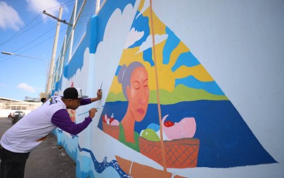 <p><strong>SAILING COMPETITION</strong>. Ilonggo artists rush to complete the Mural of Paraw Regatta Festival in Lapuz district in time for the highlight of the 2023 Paraw Regatta Festival on March 18, 2023. Over 40 paraws are joining the main sailing event on March 19 that will traverse around 30 kilometers of the Iloilo Strait starting from the Arevalo district to Guimaras province and back. <em>(Photo courtesy of Arnold Almacen/City Mayor’s Office)</em></p>