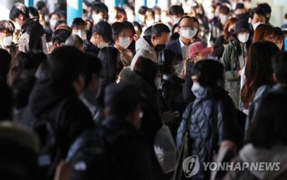 <p>Passengers remain masked up inside a subway station in Seoul on March 14, 2023. <em>(Yonhap)</em></p>