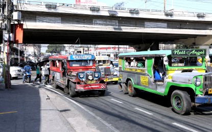 <p><strong>FARE HIKE PLEA.</strong> Public utility jeepneys at a corner of Kamias Road in Quezon City on March 15, 2023. The Land Transportation Franchising and Regulatory Board (LTFRB) on Tuesday (Aug. 15, 2023) clarified that the proposed PHP1 surge charge during rush hours has not been rejected but instead set aside to prioritize the PHP2 fare hike proposal due to the recent oil price hikes. <em>(PNA photo by Joey O. Razon)</em></p>