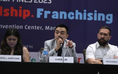 <p><strong>FRANCHISE EXPANSION.</strong> Philippine Franchise Association president Chris Lim (center) answers question in a press conference at the Crowne Plaza in Quezon City on March 15, 2023. Lim sees more franchise businesses will open outside of Metro Manila in the next few years. <em>(PNA photo by Joseph Razon)</em></p>
