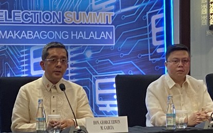 <p>Comelec chairperson George Erwin Garcia (left) and Comelec spokesperson John Rex Laudiangco (right) <em>(PNA file photo by Ferdinand Patinio)</em></p>