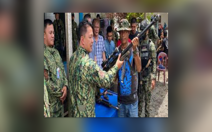 <p><strong>ARMED GROUP.</strong> Four members of a potential private armed group surrender and turned in high-powered firearms with ammunition to authorities in Barangay Bayabao, Butig town, Lanao del Sur province on Wednesday (March 15, 2023). They were allowed to go home but required to report weekly to the Butig police office for updates on their whereabouts and activities.<em> (Photo courtesy of APC-WM)</em></p>