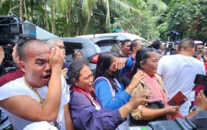 <p><strong>GRIEVING</strong>. Supporters of the late Negros Occidental Governor Roel Degamo shed tears during his funeral procession in Siaton town on Thursday afternoon (March 16, 2023). Malacañang declared a special non-working holiday in the province to allow the community to grieve and honor the memory of Degamo.<em> (Photo courtesy of Governor Roel Ragay Degamo Facebook page)</em></p>