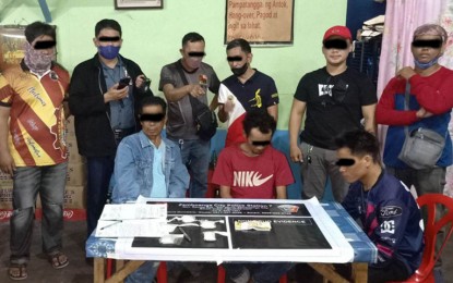 <p><strong>ANTI-DRUG OPS.</strong> Policemen arrest four drug suspects and seize over P1.1 million worth of illegal drugs in separate anti-drug operations in Zamboanga City on Wednesday (March 15, 2023). Shown in the photo are the three suspects (seated) who yielded some PHP1.1-million suspected shabu when arrested in Sitio Maestra Vicenta, Barangay Sta. Maria, Zamboanga City. <em>(Photo courtesy of ZCPO)</em></p>