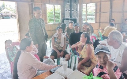 <p><strong>PEACE DIALOGUE.</strong> Philippine Army 801st Brigade commander Brig. Gen. Lenart Lelina (standing) interacts with family members of active NPA members in Borongan City, Eastern Samar. The dialogue seeks to solicit their support to convince their loved ones to abandon the communist ideology. <em>(Photo courtesy of Philippine Army)</em></p>