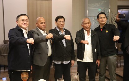 <p><strong>UNITED</strong>. Partido Demokratiko Pilipino - Lakas ng Bayan senators (from left) Christopher Lawrence Go, Ronald Dela Rosa, former president Rodrigo R. Duterte, former Energy secretary Alfonso Cusi and Sen. Robinhood Padilla posed for a picture in a Christmas dinner of the party held in Taguig City on Dec. 6, 2022. <em>(Photo courtesy of PDP-Laban FB Page) </em></p>