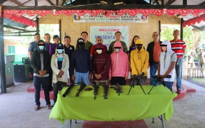 <p><strong>SURRENDER.</strong> Seven members of the Bangsamoro Islamic Freedom Fighters extremist group pose with military and local officials after their surrender in Datu Piang town, Maguindanao del Sur province on March 15, 2023. The surrenderers say they have been longing to see their families again. <em>(Photo courtesy of 6IB)</em></p>