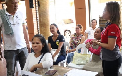 <p><strong>OWWA DESK.</strong> Surigao del Sur Gov. Alexander Pimentel (standing, left) graces the opening of the assistance desk of the Overseas Workers Welfare Administration in the Caraga Region on Thursday (March 17) at the provincial capitol. Pimentel cites the importance of the help desk for migrant workers and their families. <em>(Photo courtesy of Gov. Alexander Pimentel)</em></p>