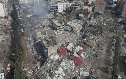<p><strong>QUAKE DAMAGE</strong>. This aerial photo taken on Feb. 7, 2023 shows collapsed buildings after a powerful earthquake in Kahramanmaras, Türkiye. Authorities said the earthquakes cost approximately 2 trillion Turkish liras (about USD105.2 billion) for the country. <em>(Photo by Mustafa Kaya/Xinhua)</em></p>