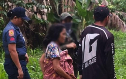 <p><strong>FEMALE REBEL.</strong> Alleged communist New People’s Army rebel, alias “Beh” (center), is escorted by police operatives after her arrest in Barangay Napnapon, Palimbang, Sultan Kudarat on Friday (March 17, 2023). She has a warrant of arrest for attempted murder. <em>(Courtesy of PRO-12)</em></p>