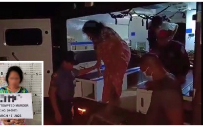 <p><strong>PREGNANT REBEL.</strong> Police and soldiers assist "Dayang," a pregnant communist rebel as she disembarks from an Army ambulance en route to an Army base medical clinic for a checkup after she was arrested on March 17, 2023 in Palimbang town, Sultan Kudarat province, for attempted murder charges. Dayang thanked the soldiers and the police for treating her well during the arrest.<em> (Photo courtesy of 6ID)</em></p>