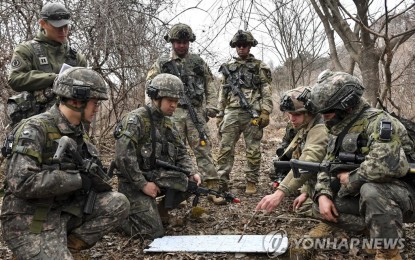 <p><strong>TACTICAL DISCUSSIONS</strong>. South Korean and US troops hold tactical discussions during the combined Korea Combat Training Center drills in Inje, 165 kilometers east of Seoul, which began March 13, 2023, in this photo provided by the South's Army on March 20. The maneuvers are to run through March 24 in connection with the allies' ongoing Freedom Shield exercise. <em>(Yonhap)</em></p>