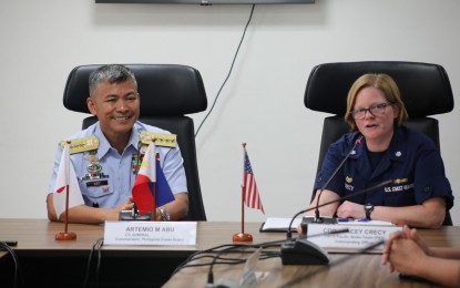<p>PCG Commandant Admiral Artemio Abu (left) and USCG Pacific Strike Team commanding officer Stacey Crecy at the PCG National Headquarters in Manila on Monday (March 20, 2023). <em>(Photo courtesy of US Embassy in Manila)</em></p>