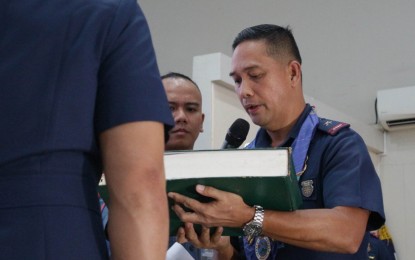 <p><strong>NEW DIRECTOR.</strong> Brig. Gen. Alden Delvo, the new director of the Police Regional Office in Davao Region (PRO-11), accepts the properties and equipment inventory book during the turnover of command on Monday (March 20, 2023) at the Camp Sgt. Quintin Merecido, Buhangin, Davao City. He replaced Brig. Gen. Benjamin Silo Jr. who is now the new head of the Philippine National Police-Civil Security Group. <em>(PNA photo by Robinson Niñal Jr.)</em></p>
