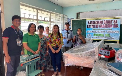 <p><strong>FOOD PROCESSING EQUIPMENT.</strong> The Department of Science and Technology 3 (Central Luzon) turns over food processing equipment to a farmers' cooperative in Gabaldon, Nueva Ecija in this undated photo. The equipment will be used by the Nagkakaisang Gabay sa Bayan ng Gabaldon to process their surplus squash harvest into such products as squash noodles, flour, and chips. <em>(Photo courtesy of DOST-3)</em></p>