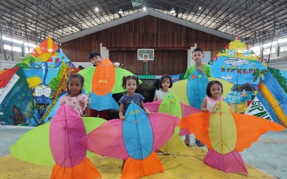 <p><strong>COLORFUL KITES</strong>. Children in Sipalay City, Negros Occidental province show the kites they made during the kite-making workshop organized by the City Tourism Development and Promotion Office together with the Kite Association of the Philippines ahead of the 9th Burangoy Tourism Kite Festival on March 23 to 26, 2023. Sipalay is considered the "Kite Tourism Capital of the Philippines" for its "enduring commitment to promote the traditional Filipino kite culture as an annual tourism activity". <em>(Photo courtesy of Sipalay City Tourism Office Facebook page)</em></p>