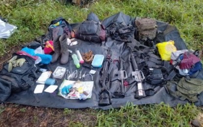 <p><strong>RECOVERED WEAPONS</strong>. Three high-powered firearms and other war materials are seized by the Army from the New People’s Army (NPA) following a firefight in Kiamba, Sarangani, on March 19, 2023. Also seized are subversive documents, mobile phones, and other personal belongings.<em> (Photo courtesy of 6ID)</em></p>