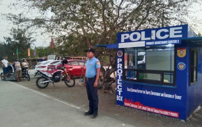 <p><strong>PROTECT BOX</strong>. A tourist cop mans a protect box of the Philippine National Police in Ilocos Norte in this undated photo. The protect box provides 24/7 protection and assistance to visitors in key destinations. <em>(Ilocos Norte Tourist Police Unit)</em></p>