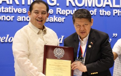 <p><strong>FILIPINO-CHINESE BUSINESS COMMUNITY.</strong> Federation of Filipino-Chambers of Commerce and Industry Inc. (FFCCII) president Dr. Henry Lim Bon Liong hands over a certificate of appreciation to Speaker Ferdinand Martin G. Romualdez during the FFCCII 33rd Biennial Convention at the Manila Hotel Tent City in Manila Friday (March 24, 2023). In his speech, Romualdez called on the Filipino-Chinese business community to help the government and Congress in creating more jobs so Filipinos would not have to go abroad for employment opportunities. <em>(Photo courtesy of the Office of Speaker Martin Romualdez)</em></p>