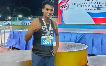 <p><strong>CHAMPION.</strong> University of the Philippines bet Marjun Sulleza gives the thumbs up sign after his golden performance in the men's Open 400m hurdles of the ICTSI Philippine Athletics Championships at the Ilagan City Sports Complex on March 24, 2023. Sulleza is a three-time Palarong Pambansa gold medalist (2016-2018), and in 2019, he won the gold medal in the junior division of the PH Open. <em>(PNA photo by Jean Malanum)</em></p>