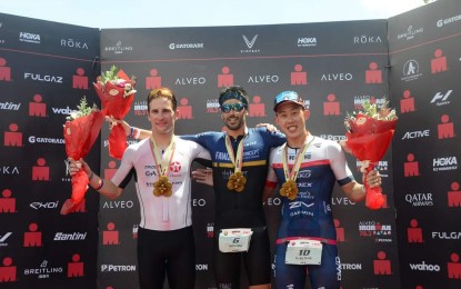 <p><strong>FINISHERS.</strong> Filipe Azevedo of Portugal (center) captures the Alveo Ironman 70.3 professional men’s title in Davao City on Sunday (March 26, 2023). Ognjen Stojanovic of Serbia (left) finished second and Chang Tuan-chun of Taiwan placed third. <em>(Courtesy of Bing Gonzales)</em></p>