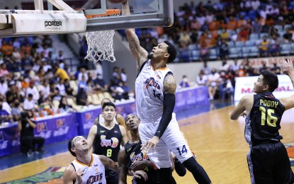 <p>KJ McDaniels goes for a dunk. <em>(Photo courtesy of PBA Images)</em></p>