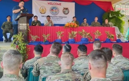 <p><strong>BALIKATAN PROJECT</strong>. Mayor Gian Carlo Occeña delivers a message during the groundbreaking ceremony of a multi-purpose hall in Barangay Inabasan, Sibalom, Antique on Monday (March 27, 2023), as troopers from the US Air Force and Philippine military officials listen. The Visayas Command said work for the Balikatan-related project is being undertaken by the combined troops of the Philippine Army’s 552nd Engineer Construction Battalion and the US Air Force's 18th Civil Engineer Group. <em>(Photo courtesy of Viscom PIO)</em></p>