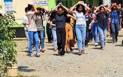 <p><strong>ILOCOS QUAKE</strong>. Students of the Dumalneg National High School in Dumalneg, Ilocos Norte apply the “duck, cover, and hold” as a magnitude 4.6 earthquake shook the province on Tuesday (March 28, 2023). The tectonic quake struck 56 km. west of Burgos town at 1:51 p.m. <em>(Photo courtesy of Dumalneg National High School)</em></p>