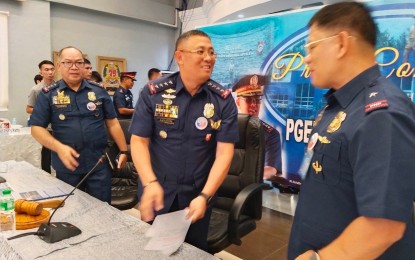 <p><strong>COMMAND VISIT</strong>. Philippine National Police chief Gen. Rodolfo Azurin Jr. (center) talks to Brig. Gen. Rommel Francisco Marbil, Eastern Visayas director (right), and Lt. Gen. Patrick Villacorte, Area Police Command-Visayas commander (left), after a press briefing on the sidelines of a command visit in the region on Tuesday (March 28, 2023). Azurin said they have evaluated about 90 percent of the more than 900 officers who submitted their courtesy resignations due to alleged involvement in illegal drugs.<em> (PNA photo by Sarwell Meniano)</em></p>