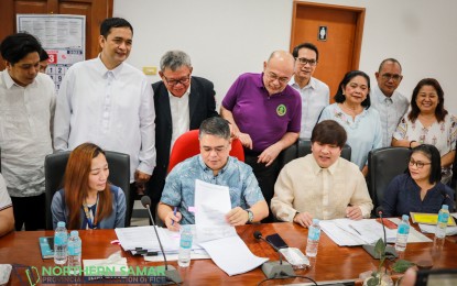 <p><strong>GENDER EQUALITY</strong>. Northern Samar Governor Edwin Ongchuan (seated, 2nd from left) signs the updated Gender and Development Code to help achieve gender equality and women empowerment in the province. Key local officials witnessed the signing on March 27, 2023 at the Northern Samar provincial capitol.<em> (Photo courtesy of Northern Samar provincial government)</em></p>