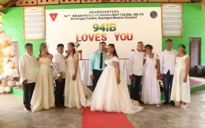 <p><strong>EX-REBELS' WEDDING.</strong> Five former New People's Army couples tie the knot at the Army's 94th Infantry Battalion headquarters in Ayungon, Negros Oriental on Tuesday (March 28, 2023). The former rebels surrendered to the battalion on separate occasions and hail from different parts of Negros Island. <em>(Photo courtesy of the Philippine Army)</em></p>