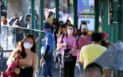 <p><strong>PROTECTION.</strong> Three years into the pandemic, Filipino commuters at the EDSA Bus Carousel in Nepa Q-Mart station in Cubao, Quezon City still wear their face masks as protection against Covid-19 and other diseases on March 29, 2023. In a recent Social Weather Stations survey, the majority, or 91 percent, of adult Filipinos interviewed agree with the voluntary wearing of face masks.<em> (PNA photo by Joey O. Razon) </em></p>