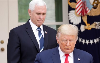 <p><strong>SUMMONED. </strong>Former US President Donald J. Trump (front) and Former US Vice President Mike Pence (rear) in the Rose Garden of the White House in this March 2020 photo.  Pence was ordered to testify before a grand jury in connection with the Jan. 6, 2021 Capitol siege. <em>( Yasin Öztürk - Anadolu Agency )</em></p>