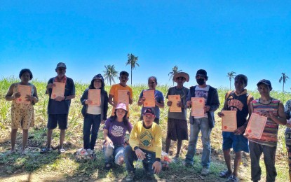 <p><strong>FARMER-BENEFICIARIES</strong>. Some 12 agrarian reform beneficiaries receive land titles for 15.74 hectares of agricultural land in Barangay Cabahug, Cadiz City on March 22, 2023. The distribution was facilitated by the Department Agrarian Reform Negros Occidental I-North through the field office led by Municipal Agrarian Reform Officer Hanna Hubay.<em> (Photo courtesy of DAR Negros Occidental I-North)</em></p>