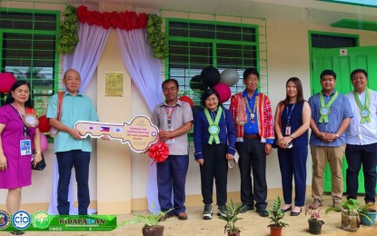 <p><strong>IP SCHOOL BUILDING.</strong> Japan Consul General Yoshihisa Ishikawa (second left) hands over the symbolic key for the PHP5.1-million new school building to Datu Igwas IP Integrated School teacher-in-charge Johnny Serrano in Kidapawan City, North Cotabato, on Wednesday (March 30, 2023). The project is under the consulate office’s Grant Assistance for Grassroots Human Security Projects. <em>(Photo courtesy of Kidapawan CIO)</em></p>