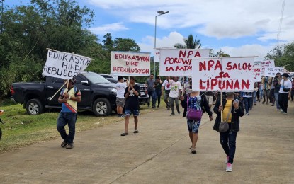 <p><strong>WITHDRAWAL OF SUPPORT</strong>. Former rebels join a rally in Quezon Jr. village in Ormoc City on March 29, 2023. Some 121 former rebels and their supporters formally declared their withdrawal of support to the NPA's cause. <em>(Photo courtesy of Philippine Army)</em></p>