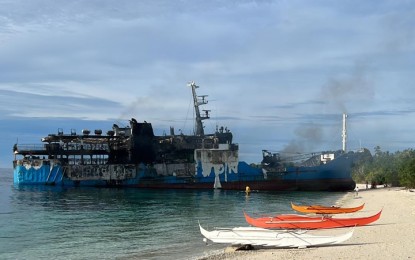 <p><strong>MARITIME TRAGEDY</strong>. M/V Lady Mary Joy 3 runs aground after catching fire near Hadji Muhtamad town, Basilan province while en route to Jolo, Sulu on March 29, 2023. Basilan Rep. Mujiv Hataman on Tuesday (April 4) said he will file a resolution seeking a congressional inquiry into the fire incident.<em> (Contributed photo)</em></p>