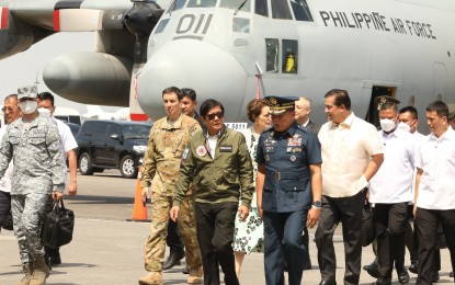 <p><strong>AIR ASSETS.</strong> President Ferdinand R. Marcos Jr. (center), accompanied by Philippine Air Force chief Lt. Gen. Stephen Parreño, inspects the two C-130T aircrafts that underwent upgrade and overhaul during his visit at the Haribon Hangar in Clark Air Base, Pampanga on Friday (March 31, 2023). Marcos said the recommissioning of the air assets will enable the Air Force to more effectively conduct various missions, especially those involving humanitarian assistance and disaster response operations. <em>(PNA photo by Rey Baniquet)</em></p>